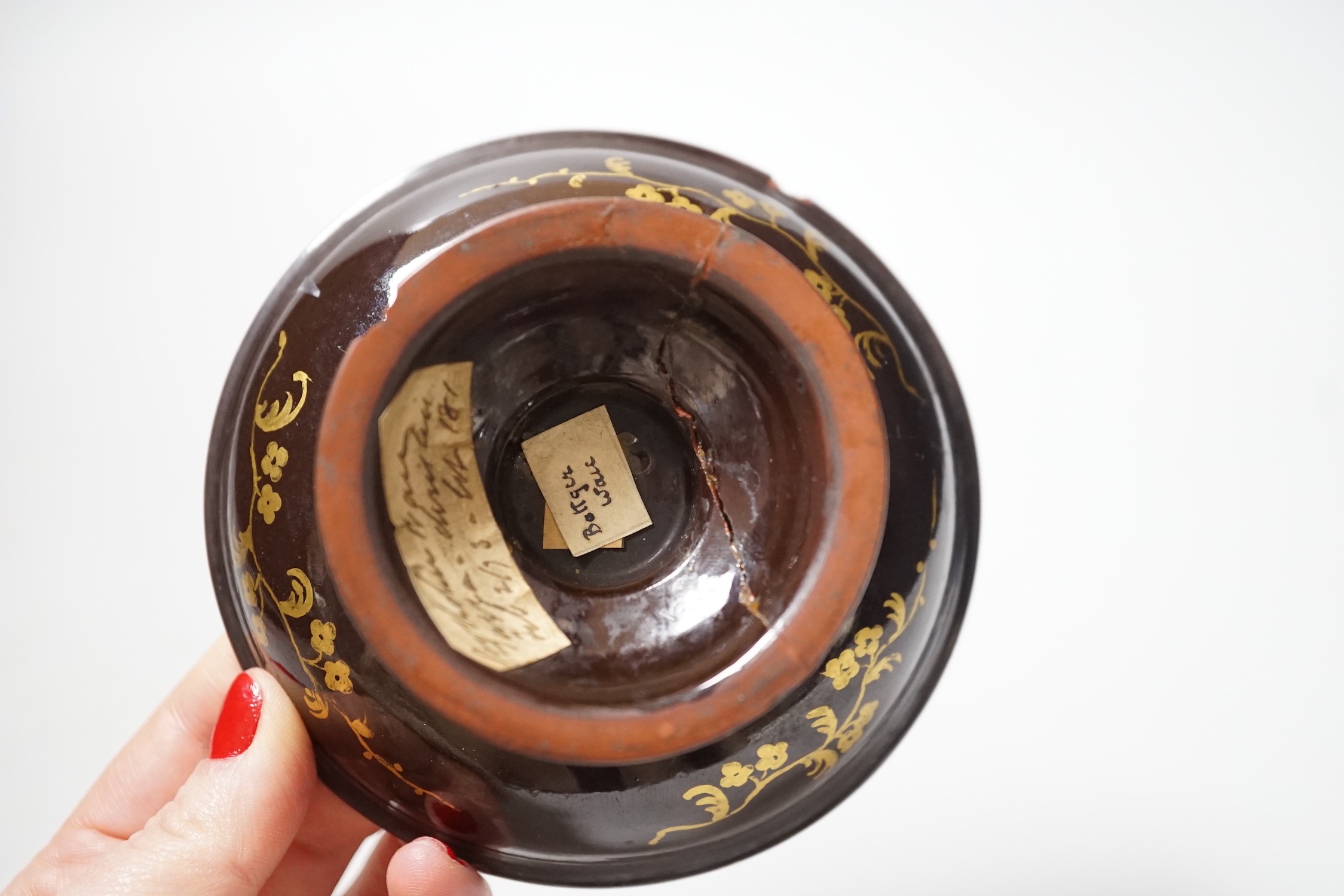 A Bayreuth glazed and gilded footed dish, c.1730-40, in imitation of Böttger stoneware, 11.2cm diameter, foot glued